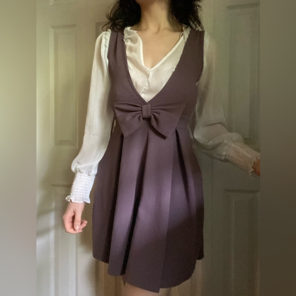 Iris purple pleated mini dress with bow pinafore